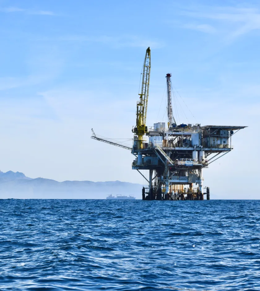 Offshore wind farm at sea with turbines on the horizon